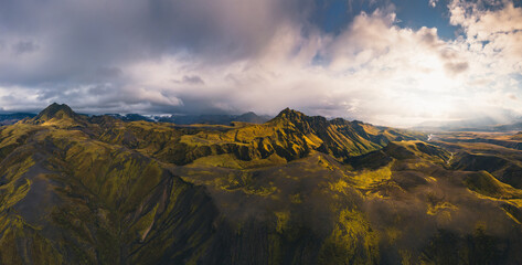 Naklejka na ściany i meble Aerial panorama of the summer Highlands in Iceland. Thorsmork valley surrounded by the glaciers and a high mountains. High resolution photograph. High quality photo