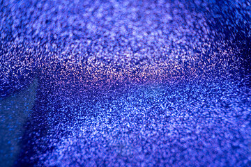 Deep blue and purple glitter paper texture, sparkling shiny abstract stucture
