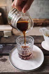 barista dripping coffee and slow coffee bar style