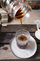 barista dripping coffee and slow coffee bar style