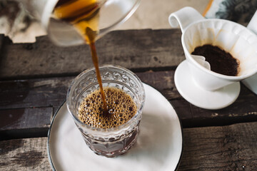 barista dripping coffee and slow coffee bar style