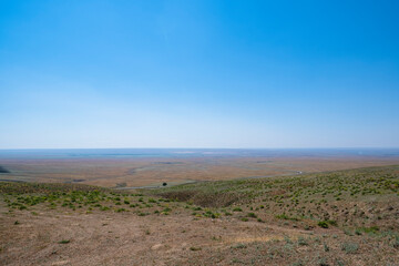 Fototapeta na wymiar Landscape on the steppe from the height of the mountain range