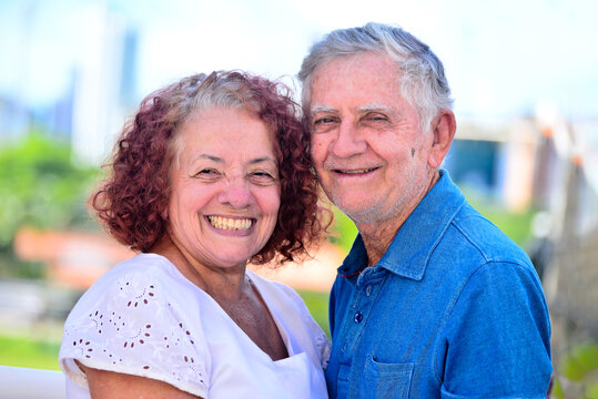 portrait of elderly couple smiling, National Day of the Elderly, International Day of the Third Age, s3nior life, elderly woman with red hair, hair transition