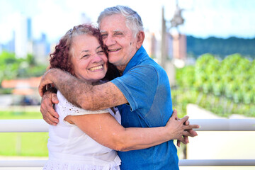 portrait of senior couple holding each other outdoors,valentine's day,National Day of the...