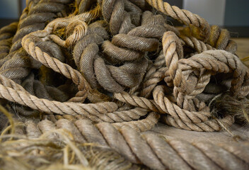 Fototapeta premium Multiple worn ropes giving a nautical, old west or industrial feel
