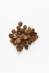 Dried burdock roots (arctium) on isolated white background