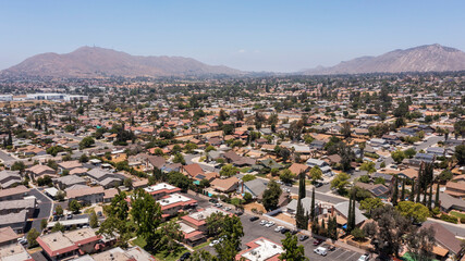 Daytime aerial view of a suburban neighborhood in Moreno Valley, California, USA.