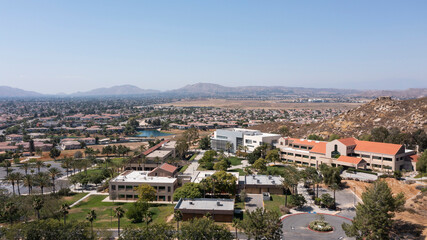 Fototapeta na wymiar Daytime aerial view of a suburban neighborhood in Moreno Valley, California, USA.