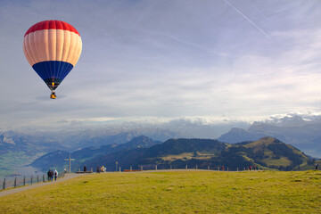 Hot air balloon flying over the Mount Rigi Lucerne, Switzerland
