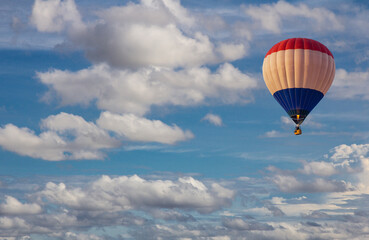 Naklejka premium Aerial view of hot air balloon flying in the blue sky. Scenic view beautiful cloudy blue sky.