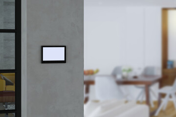 Video intercom display on wall near the entrance door, security system safety in modern apartment.