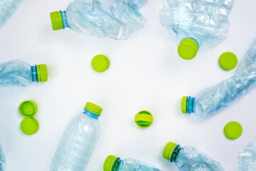 plastic bottles and caps on white background