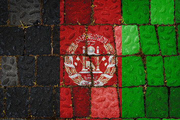 National flag of Afghanistan on stone  wall background. Flag  banner on  stone texture background.