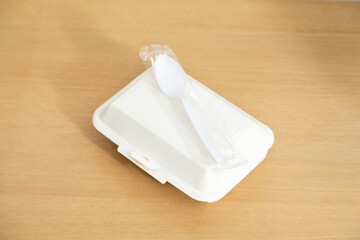 Food containers box on wood table. Food delivery service.