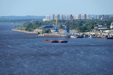 Obraz premium River port. Extraction and transportation of river sand on barges in the summer. High quality photo