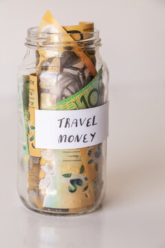 21 money jar full of australian notes for holiday trip