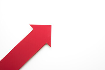 Big real red arrow for presentation or slideshow. pointing upright for increase growth and a good forecast.  Natural white background.