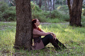 portrait of red haired girl wearing fantasy medieval clothes of a wandering adventurer.  natural...