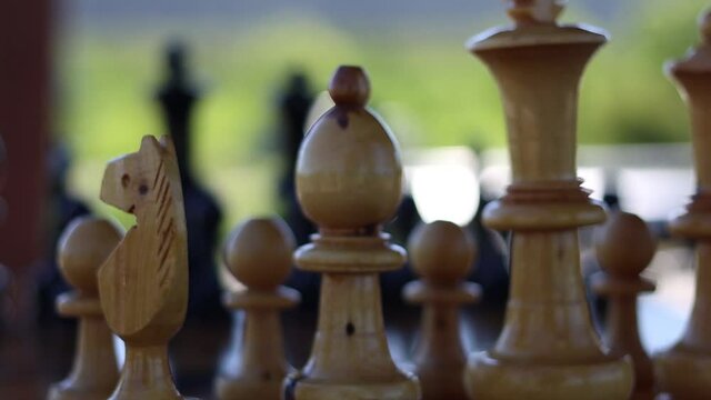 The white rank in a game of chess looking through to the opponents pieces.