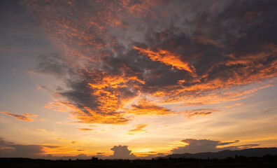 Colorful sunset and sunrise with clouds.Orange color of nature.Many clouds in the sky. sunset in the clouds.The sky is twilight.