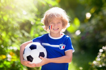 Obraz premium France football fan kids. Children play soccer.