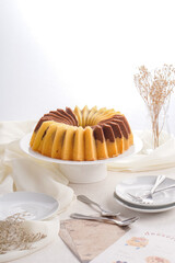 A marble cake is a cake with a streaked or mottled appearance (like marble) achieved by very lightly blending light and dark batter. It can be a mixture of vanilla and chocolate cake