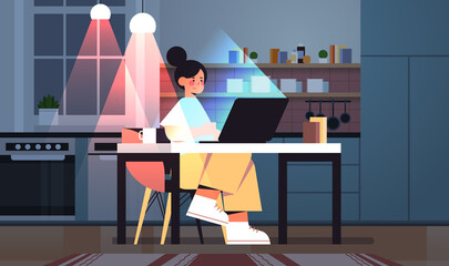 overworked businesswoman freelancer looking at laptop screen woman sitting at workplace in dark night home room
