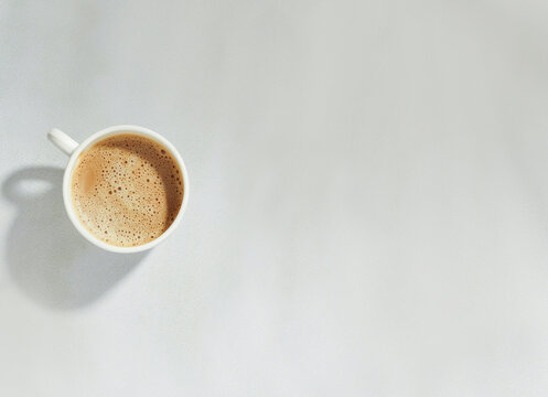 top angle of Porcelain cup of tea isolated on white background with copy space