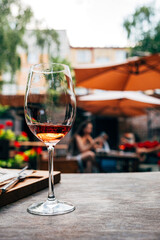 people drinking wine on the summer terrace
