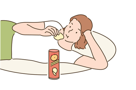 A girl is lying comfortably on a cushion and eating potato chips. hand drawn style vector design illustrations. 