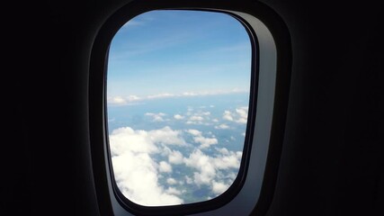 Sky in the porthole. Blue sky view from airplane window. - Powered by Adobe