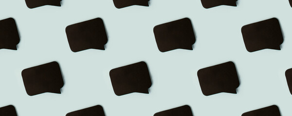 Black chat cloud, speech bubble icons on blue color background. Talking and message for social media concepts ideas, banner for site, mock up, copy space