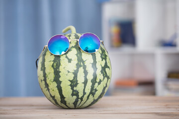 A watermelon wearing sunglasses