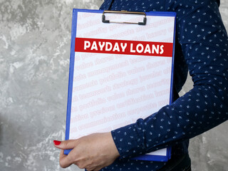 Business concept meaning PAYDAY LOANS with phrase on the page.