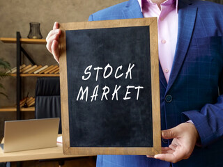 Business concept meaning STOCK MARKET with phrase on the blackboard.