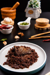 Beef Rendang is a Minang dish originating from the Minangkabau region in West Sumatra, Indonesia.  Rendang has been slow cooked and braised in a coconut milk seasoned with a herb and spice mixture