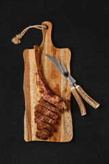Tomahawk steak cut on slices