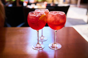 Aperol Spritz cocktail aperitif outdoors with shallow depth of field