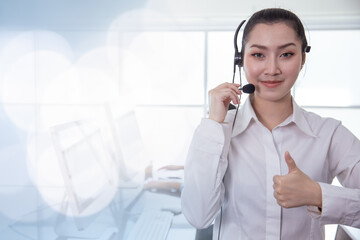 Portrait Asian callcenter operator thumbs up. Helpdesk support phone call customer care female...