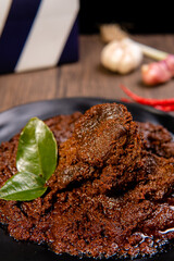 Beef Rendang is a Minang dish originating from the Minangkabau region in West Sumatra, Indonesia.  Rendang has been slow cooked and braised in a coconut milk seasoned with a herb and spice mixture