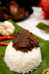 Beef Rendang is a Minang dish originating from the Minangkabau region in West Sumatra, Indonesia.  Rendang has been slow cooked and braised in a coconut milk seasoned with a herb and spice mixture