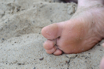 Female barefoot view from below. The sole of an adult woman lies