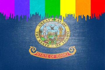 Paint (rainbow flag) is dripping over the state flag of Idaho