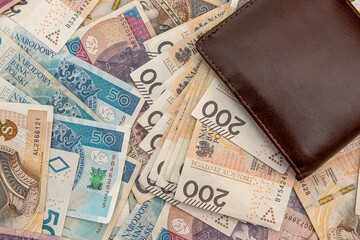 leather wallet with calculator on polish zloty banknotes