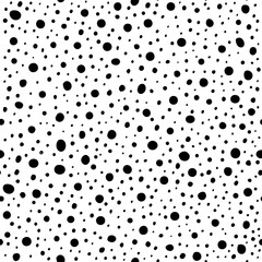 Vector illustrations of abstract hand drawn polka dots and spots seamless pattern. Good for backgrounds, textiles, fabrics, wrapping paper and wallpaper. Black and white colors.
