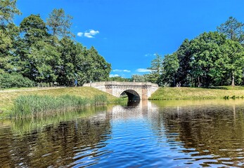 The Carp Bridge is a pedestrian bridge over an artificial cascade between the Carp Pond and the White Lake, connecting the two parts of the Long Island in the Palace Park of the Gatchina Museum-Reserv