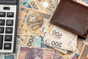 leather wallet with calculator on polish zloty banknotes