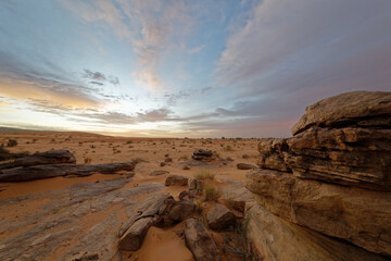 Desert sunrise with dramatic clouds at Tifoujar, Adrar region, Mauritania.