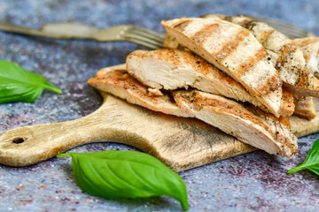  Grilled chicken fillets with  olive oil, chili pepper,   and tomato paste 