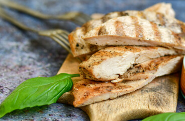  Grilled chicken fillets with  olive oil, chili pepper,   and tomato paste 